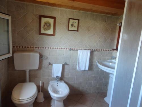 Ванная комната в Punta Di Mola