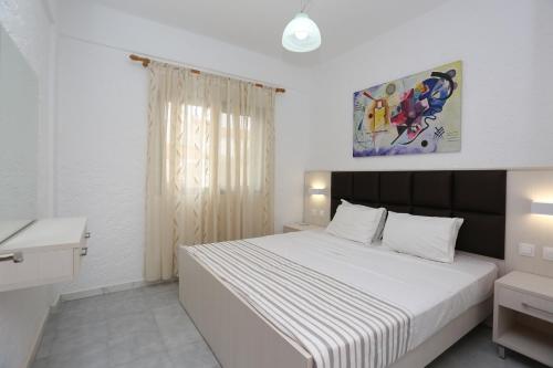 Ένα ή περισσότερα κρεβάτια σε δωμάτιο στο Villa Repas