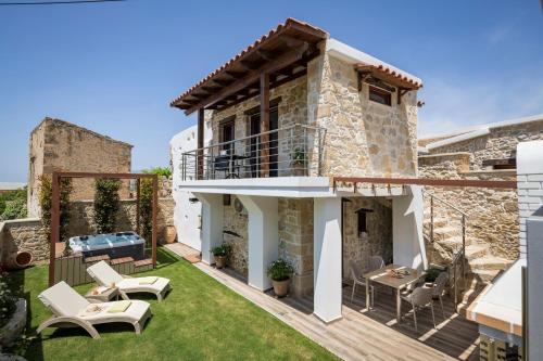 a villa with a view of the garden at Doro Villas in Drapaniás