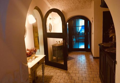 a hallway with a mirror and a door in a room at Pension Verona in Nový Bor