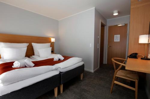 Postel nebo postele na pokoji v ubytování Hotel Bethel