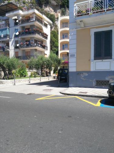 a car parked in a parking lot next to a building at Casa Azulejos in Maiori