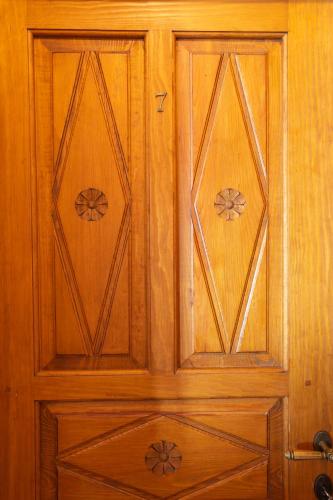 a pair of wooden doors in a room at Archontiko Montana in Vizitsa