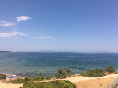 a view of the ocean from a beach at Euphoria Blue studio apartments in Artemida