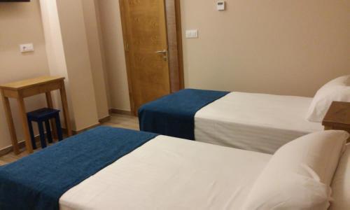 Postel nebo postele na pokoji v ubytování Fragas da Canteira Hotel Rural