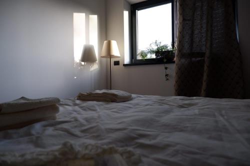 Postel nebo postele na pokoji v ubytování Appartamenti e B&B Casa Ester