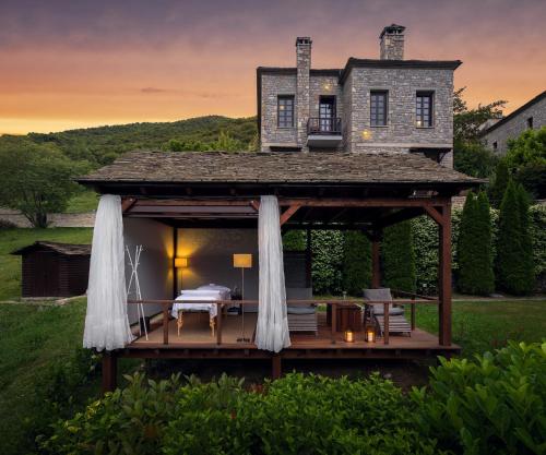 a gazebo with a house on top of it at Aristi Mountain Resort in Aristi