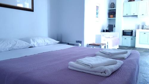 Säng eller sängar i ett rum på Cycladic Vineyard House