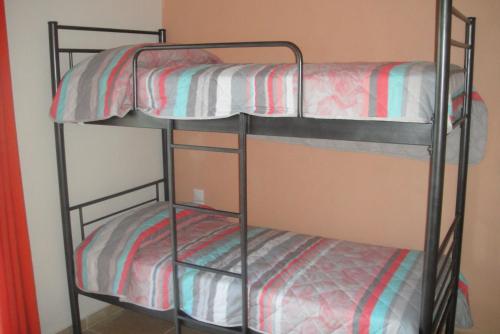 two bunk beds in a dorm room at Navarone Villas in Petrokhorion