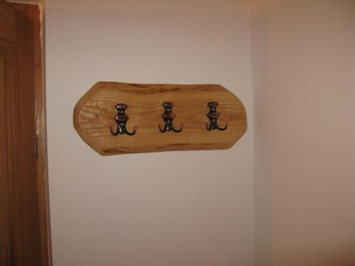 a wooden object hanging on a wall at Vodenica Lug in Strmosten