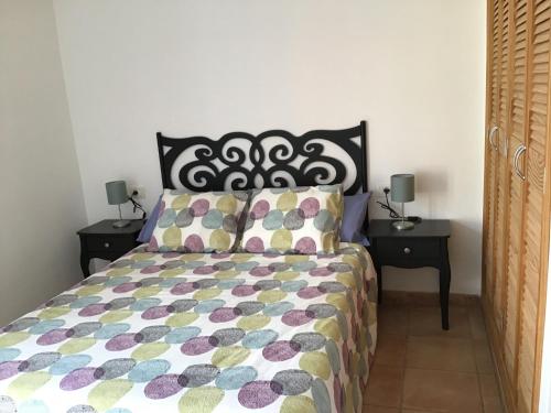 En eller flere senge i et værelse på Baja Larga