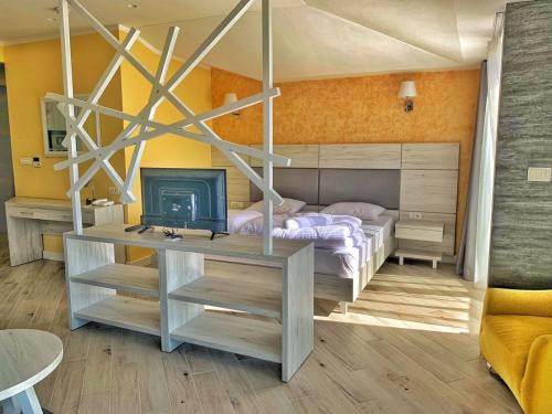Säng eller sängar i ett rum på Hotel Pierina