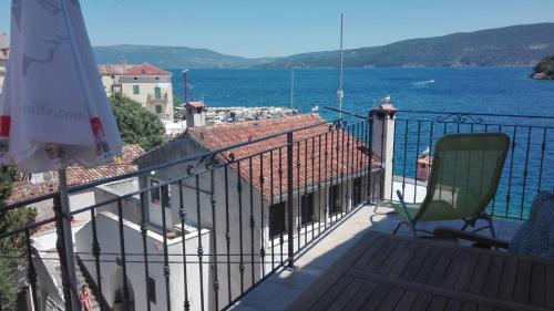 a balcony with a view of the water at Apartments & Rooms Dinko in Valun