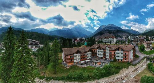 an aerial view of a resort town in the mountains at Residence Pez Gajard in San Martino di Castrozza