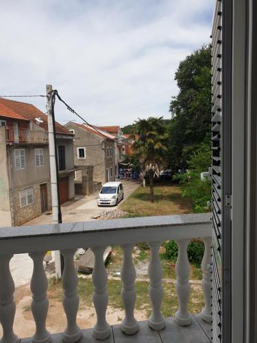 a view of a street from a balcony at Apartments Martinović By The Sea in Kukljica