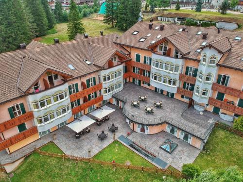 a large building with a lot of windows on top of it at Residence Pez Gajard in San Martino di Castrozza