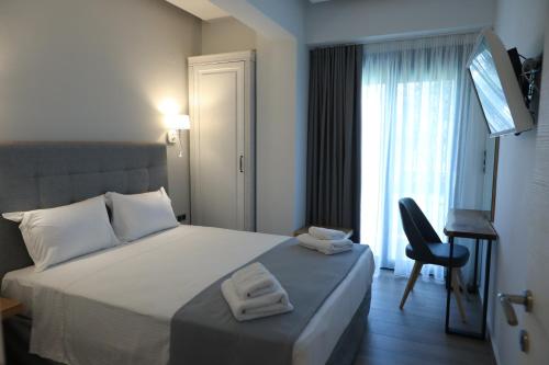 Ένα ή περισσότερα κρεβάτια σε δωμάτιο στο Saint George Nikiti Villas
