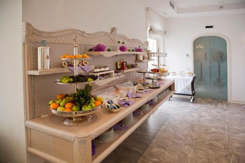 a long table with a bunch of food on it at Hotel Villa Florida & Suite Apartments in Gardone Riviera