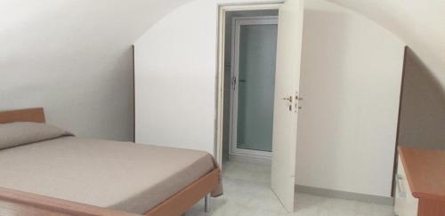 Postel nebo postele na pokoji v ubytování CASA GENTILE