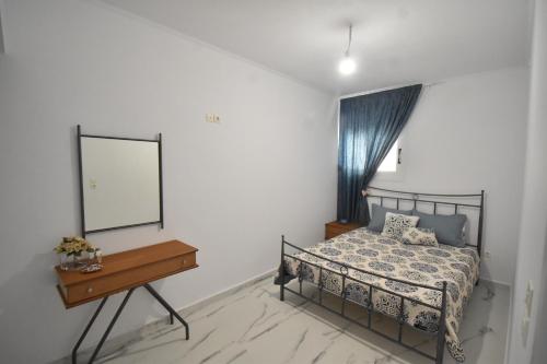 Postel nebo postele na pokoji v ubytování Anesis Apartment