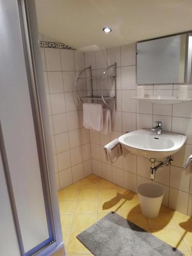 a bathroom with a sink and a mirror at Haus Vordertiefenbach in Wagrain