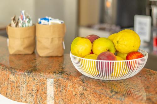 a bowl of fruit sitting on top of a counter at Hotel Ascot in Cervia
