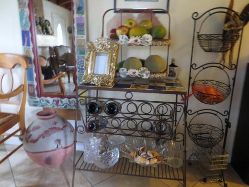 a shelf with fruits and other items in a room at Always Inn San Clemente Bed & Breakfast by Elevate Rooms in San Clemente
