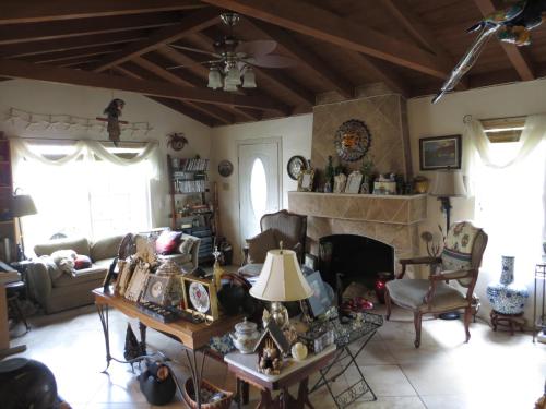 a living room with a couch and a fireplace at Always Inn San Clemente Bed & Breakfast by Elevate Rooms in San Clemente