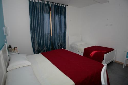 Cama o camas de una habitación en Bed & Breakfast Nettuno