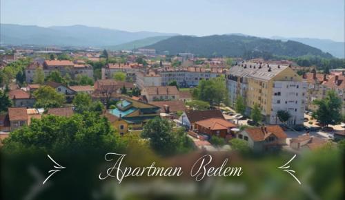 a view of a town with buildings and trees at Apartman Bedem in Nikšić