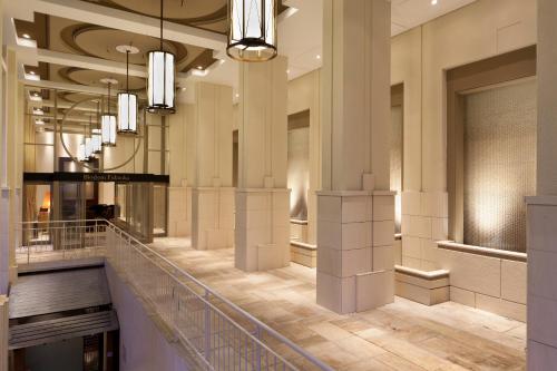 a lobby of a fashion store with chandeliers at JR Kyushu Hotel Blossom Fukuoka in Fukuoka