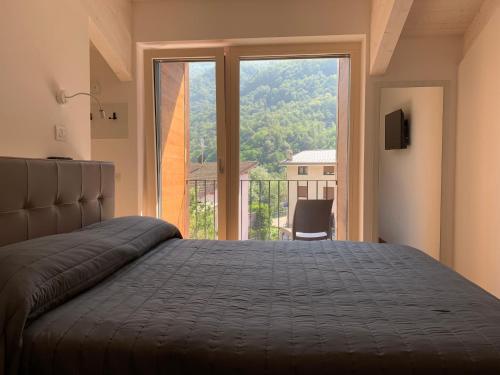 Ένα ή περισσότερα κρεβάτια σε δωμάτιο στο Italo-Svizzero