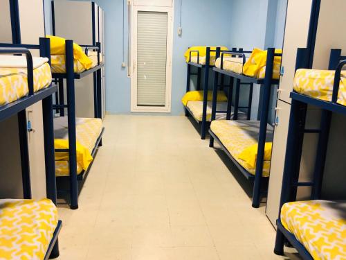 a row of bunk beds in a dorm room at Alberg Deltebre Xanascat in Deltebre