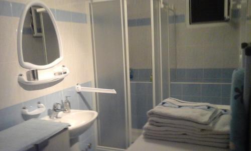 a bathroom with a shower and a sink at Apartmani Božić-Omišalj in Omišalj