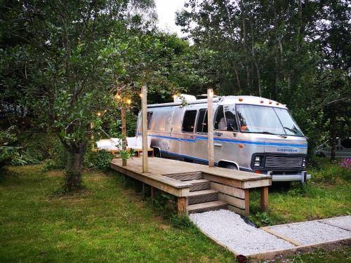 a van is parked on a wooden bridge at Glamping 1970 American Airstream motorhome in Ponsanooth