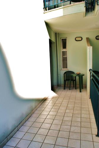 a hallway of a house with a table and chairs at Residence Le Vele in Cattolica