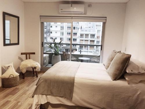 Ένα ή περισσότερα κρεβάτια σε δωμάτιο στο My Soho Serrano