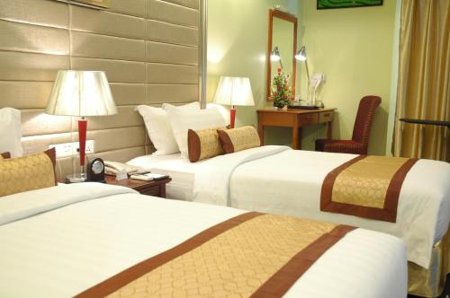 Postel nebo postele na pokoji v ubytování Best Western Green Hill Hotel
