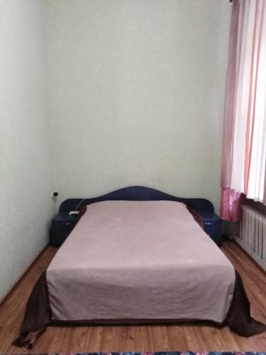 En eller flere senge i et værelse på Welcome Apartments in Odessa