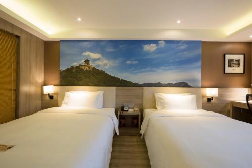 Säng eller sängar i ett rum på Atour Hotel (Taiyuan Zonggai Shifanqu)