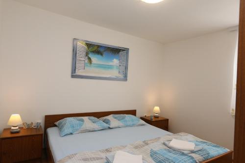 Ένα ή περισσότερα κρεβάτια σε δωμάτιο στο Apartment DamirK
