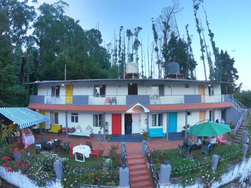 a house with colorful paint on the side of it at REFLECTIONS Guest House in Ooty