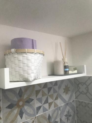 a shelf with a basket on top of a wall at La CIASSA 00942-LT-0372 in Noli
