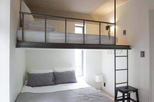 a bedroom with a bunk bed in a room at DW STAY HONGDAE in Seoul