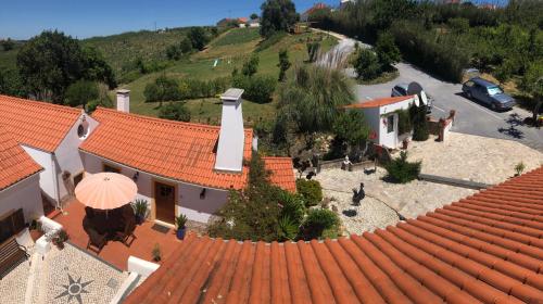 an overhead view of a house with an orange roof at Quinta do Bom Vento in Óbidos