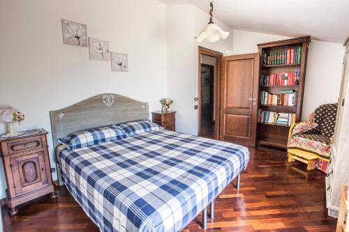 a bedroom with a bed and a book shelf at B&B Marconi in Montefalcone Appennino