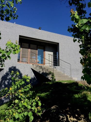 a building with stairs and a window on it at Stone Party in Donghe