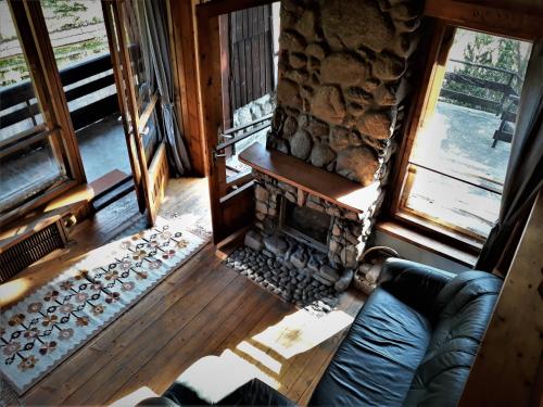 an overhead view of a living room with a fireplace at Willa Gawra in Zakopane
