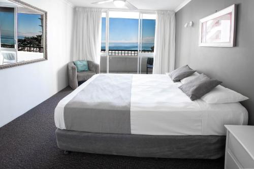 Ένα ή περισσότερα κρεβάτια σε δωμάτιο στο View Pacific Apartments