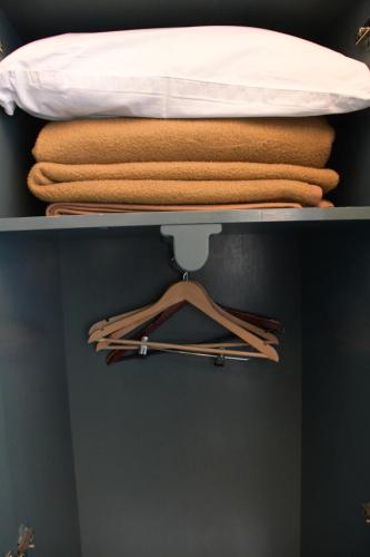 a shelf with a bed and towels on it at Hotel HAL-TUR in Pamukkale